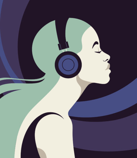Profile of a young woman listens to the music on the headphones. Profile of a young woman listens to the music on the headphones.
